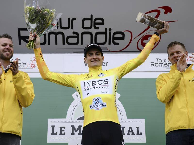 Carlos Rodriguez on the winner's podium at the Tour de Romandie in Vernier, Switzerland. (AP PHOTO)
