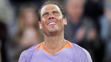 Rafael Nadal was the picture of delight after his revenge win over Alex de Minaur in Madrid. (AP PHOTO)