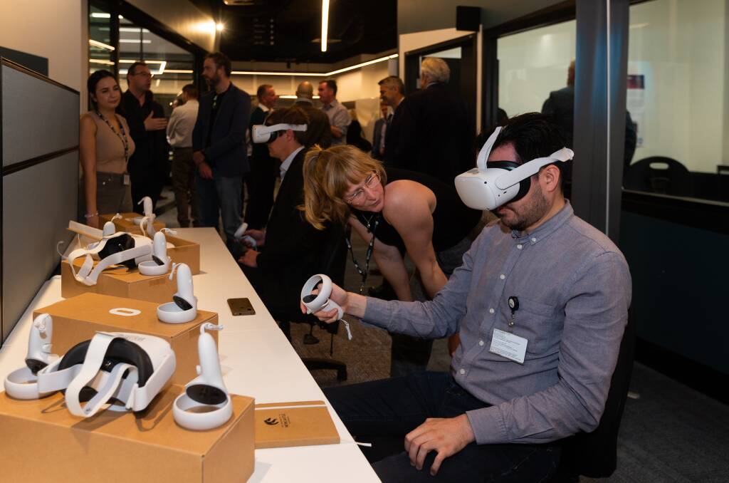 Murielle Kluge (left) and Maximiliano Quimbar testing virtual reality equipment at the launch of the Health Innovation Living Lab. Picture by Jonathan Carroll 