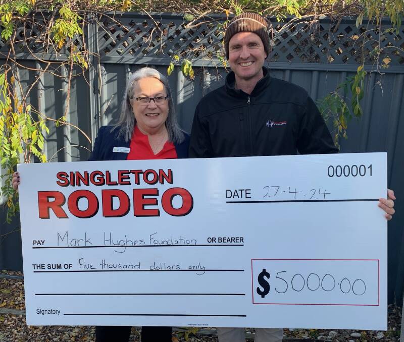 NAA president Deb Townsend present the $5000 donation cheque to Mark Hughes from the Mark Hughes Foundation. Picture supplied
