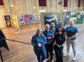 Chryse Levick (left) with her crew at the Civic Centre hanging 529 artworks ready for opening night this Friday of the 2024 Singleton Art Prize.