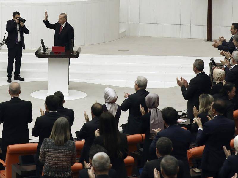 Turkish President Tayyip Erdogan took an oath in front of the legislators elected to parliament. (AP PHOTO)